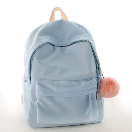 Customer photograph of a light blue school backpack with a rounded top and a front pocket